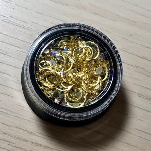 Moon and rhinestone embelishments nail