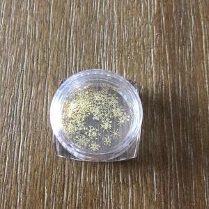 gold snowflake embelishments nail