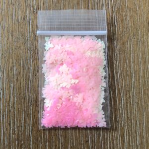 121# Pink iridescent bow glitter 1tsp