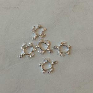 Open bezel silver turtle pendant