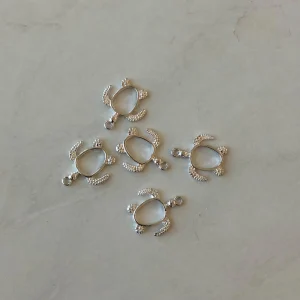 Open bezel silver turtle pendant